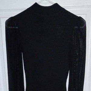 Black knit and tulle long sleeves dress.